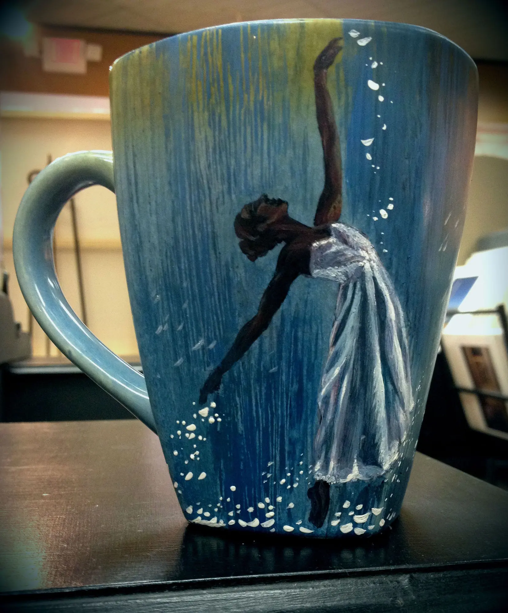 A hand-painted mug with a ballerina